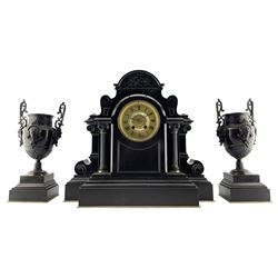 French - Belgium slate mantle clock and garniture c1880, in a breakfront case on a deep stepped plinth, rounded top with recessed carving and decoration, two-part gilt dial with an ivorine and decorative pierced centre, gilt chapter ring with Roman numerals and brass hands, 8-day Parisian movement striking the hours and half-hours on a coiled gong, with conforming urn garnitures. With pendulum. 
Garnitures 38cm high.
