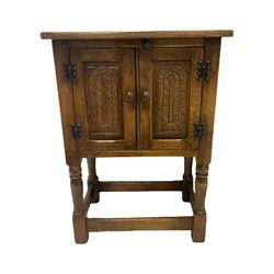 Oak hutch cupboard, with carved cupboards on turned supports