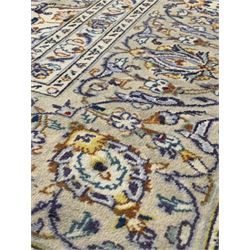 Persian Kashan hand knotted ivory ground carpet, decorated with interlaced scrolling foliate all over 330cm x 245cm