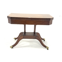  Regency mahogany card table, with rosewood cross banded and string inlaid top hinged to reveal baize lined playing surface, raised on four splayed supports with brass hairy paw castors, W91cm, H71cm, D45cm  