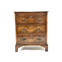 George III style walnut chest, with cross banded top over brushing slide and three long graduated drawers, raised on shaped bracket feet, W65cm, H77cm, D46cm