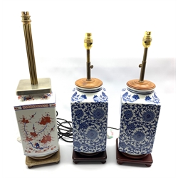 Pair of Oriental blue and white square section lamps on hardwood stands, H57cm and another similar lamp decorated in the Imari style 