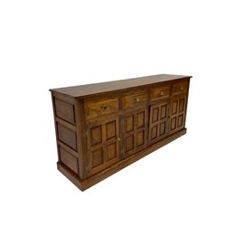 Elm sideboard, fitted with four drawers over four cupboard doors, opening to reveal one fixed shelf, raised on a plinth base 