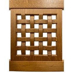 Mouseman - oak rocking armchair, double pierced and carved lattice back, upholstered in tan leather with stud work, octagonal front supports, carved with mouse signature, by the workshop of Robert Thompson, Kilburn 
