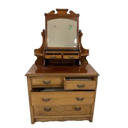 Edwardian mahogany dressing chest, top section fitted with two trinket drawers, rectangular top over two short and two long graduating drawers, raised on stile supports with shaped apron
