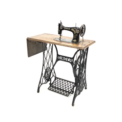 Early 20th century Singer treadle sewing machine with cast iron base 