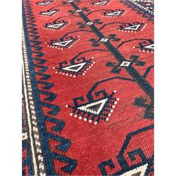 Caucasian design runner, red field with black and blue geometric design, enclosed by border 76cm x 183cm