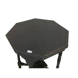 Edwardian black paint and wax finish centre table, moulded octagonal top on four turned supports joined by undertier, on brass and ceramic castors