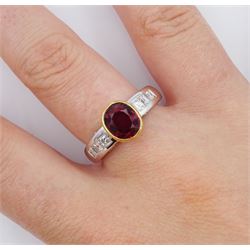 18ct white and yellow gold oval cut ruby ring, with channel set princess cut diamond shoulders and round brilliant cut diamond gallery, hallmarked, ruby approx 2.20 carat