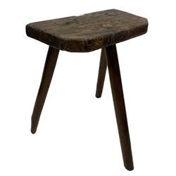 Oak milking stool, raised on three turned supports 