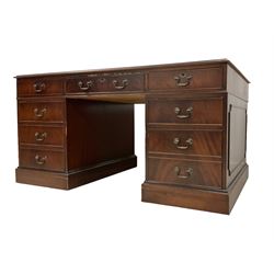 George III design mahogany twin pedestal desk, rectangular top with three leather inset writing surfaces, fitted with eight cockbeaded drawers, raised on two plinth bases