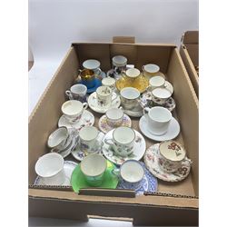 Royal Crown Derby Imari 2451 coffee cup and saucer, together with a quantity of porcelain tea/ coffee cups and saucers including Tuscan China, Crown Staffordshire, Royal Doulton, two 1911 commemorative beakers etc in two boxes