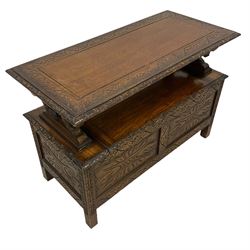 17th century design carved oak monks bench, metamorphic panelled top with foliate carvings, over box seat with hinged lid and lion arm terminals