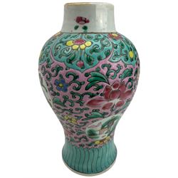 20th century Chinese Famille Rose baluster form jar, decorated with panels of Dragons, against a pink and scroll ground, H23cm
