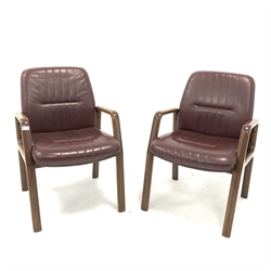  Vaghi - Pair of Italian mid 20th century office armchairs, the oxblood leather upholstered seat and backs raised on polished laminate wood frame, W60cm  