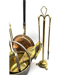 Victorian copper and brass handled kettle, pair of brass companion stands on triform base, H58cm, two brass jam pans, pair of Arts & Crafts embossed brass and copper bellows etc