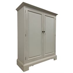 Contemporary traditional white painted cupboard, two panelled doors enclosing two shelves, on bracket feet
Provenance: From the Estate of the late Dowager Lady St Oswald