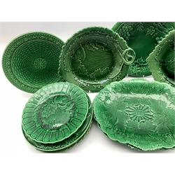 Pair of 19th century Wedgwood green glazed leaf moulded oval shallow dishes W28cm, pair of similar plates on short pedestal foot marked R S and eleven other leaf moulded plates (15) 