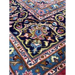 Persian red ground carpet, floral medallion on busy field enclosed by triple guarded border 250cm x 342cm