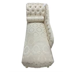 Chaise longue, scroll end upholstered in button-back ivory damask fabric, raised on cabriole supports, with baluster cushion 