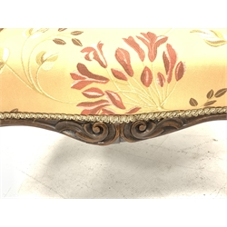 Victorian rosewood armchair, scrolled arms supports and carved cabriole feet on brass castors, upholstered in buttoned floral pattern fabric, W72cm, seat depth - 55cm