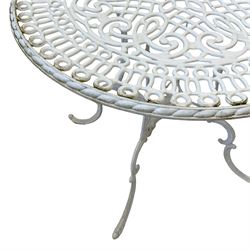 White painted cast alloy metal garden table, scrolling circular top over undertier, on c-scroll supports