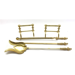 Early 20th century brass three-piece companion set together with a pair of  brass fire dogs by Benham & Froud (5)