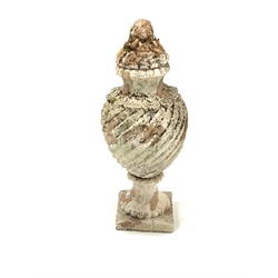Lidded terracotta urn, the wrythen body supported by a socle on square base, well weathered and with loose paint, H84cm