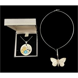 Anton Michelsen for Royal Copenhagen, a circular porcelain pendant designed by Nils Thorsson with silver mount stamped 925 D3.5cm together with a Royal Copenhagen porcelain pendant in the form of a Butterfly on silver choker stamped 925S (2)