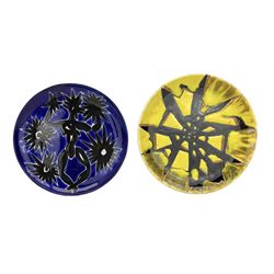 Jean Lurçat (French 1892-1966): Blue and black glazed teracotta plate decorated with a stylized figure, signed beneath 'Dessin J. Lurcat Sant Vicens L.S?' D22.5cm, together with a similar style glazed plate (2)