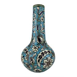 Burmantofts Faience Anglo-Persian vase, designed by Leonard King, of bottle form, painted with stylized flowers and foliage against a blue ground, impressed factory marks, model no. 36, incised 'Design 65, 362' and artists monogram LK, H35cm