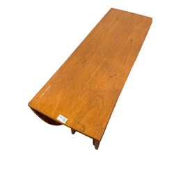 Mid century teak dropleaf table, the oval drop leaf top raised on turned supports 