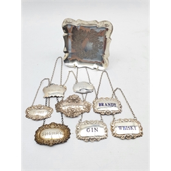 Set of three silver decanter labels with blue lettering Birmingham 1977, five other silver decanter labels and an engraved silver small tray 6.7oz