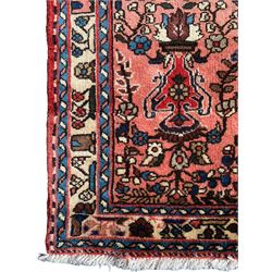 Persian Sarough peach ground runner, the field decorated with repeating floral urns, guarded border decorated with repeating flowerhead motifs