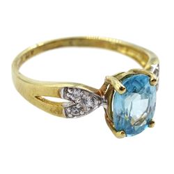 9ct gold oval blue zircon ring, with white zircon set shoulders, hallmarked