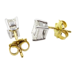 Pair of 18ct white gold emerald cut diamond stud earrings, hallmarked, diamond total weight 1.8 carat