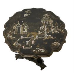 Late 19th century papier-mache lacquered chinoiserie occasional table, circular top with shaped and moulded edge, inlaid with mother of pearl and gilt pagoda scenes, the shaped frieze decorated with gilt foliate scrolls, raised on hexagonal pedestal terminating in triform base