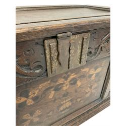 19th century oak coffer, the hinged lifting lid over blind carved frieze and panelled base, raised on bracket supports 