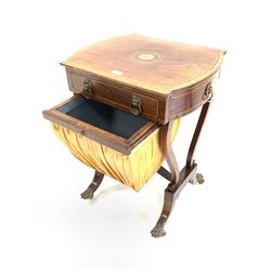 Regency mahogany work table, rectangular top with bowed sides with cross banded and box wood stringing, above drawer and faux drawer featuring lion mask pull handles, and silk covered sliding box, shaped uprights and four splayed supports terminating in brass hairy paw castors (W54cm, D45cm, H71cm)