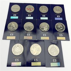 Eleven Queen Elizabeth II United Kingdom five pound coins, each housed in a 'Change Checker' card