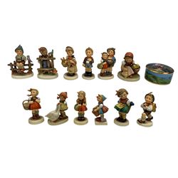 Ten Hummel figures comprising School Girl and Boy, Little Shopper, Goose Girl, Bashful, Little Helper, Pretzel Girl, Surprise, Wayside Harmony and Cheeky Fellow, all boxed, Hummel Apple Tree Girl music box, boxed and two other Hummel figures without boxes