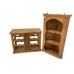 Pine bottle rack with three shelves with a fruit and foliate carved panel, together with a pine corner cupboard with two shelves 
