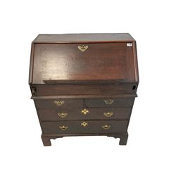 Early George III oak bureau, fall-front with moulded rest and edge, enclosing fitted interior with secret compartment, pigeonholes and cascading shelves, over two short and two long drawers, raised on bracket feet