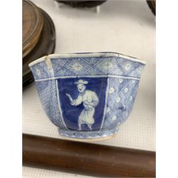 19th century Chinese cylindrical jar and cover decorated with a landscape in blue and white H11cm, Chinese blue and white saucer dish, small Japanese bowl, Chinese wooden pipe and Oriental plate stand and five further hardwood stands (10)
