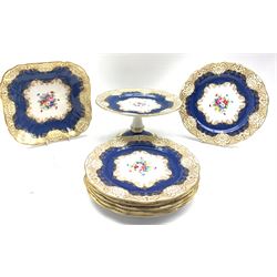 Crown Staffordshire part dessert service with a powder blue ground and decorated with floral sprays consisting of six plates, one serving dish and comport, pattern no. A13990