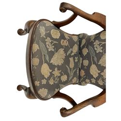 George II walnut elbow chair, upholstered in floral pattern fabric, shaped arms with scrolled terminals, plain seat rail with drop-in seat cushion, on cabriole supports with c-srcoll carved brackets