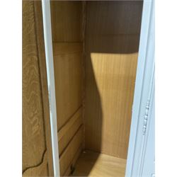 20th century French style white painted triple Armoire wardrobe, the shaped projecting shell pediment over four doors, raised on scrolled cabriole supports W220cm, H205cm, D60cm 