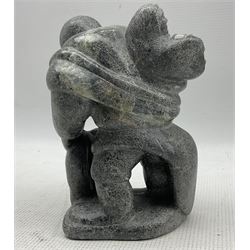 Levi Qumaluk (Inuit, Povungnituk/Puvirnituq, 1919-1997): a carved stone sculpture, modelled as a mother carrying a child in her amauti, signed Levi, with Canada Eskimo Art sticker, H16cm 