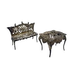  Continental silver miniature settee with pierced and embossed decoration L10cm, import mark London 1900 and a miniature table W7cm import mark 1901 3.5oz 