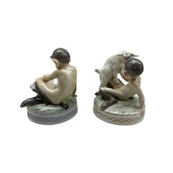 Two Royal Copenhagen figures 'Faun with Goat' no. 498 and 'Faun with Rabbit' no. 439, both designed by Christian Thomsen, H13cm max (2)